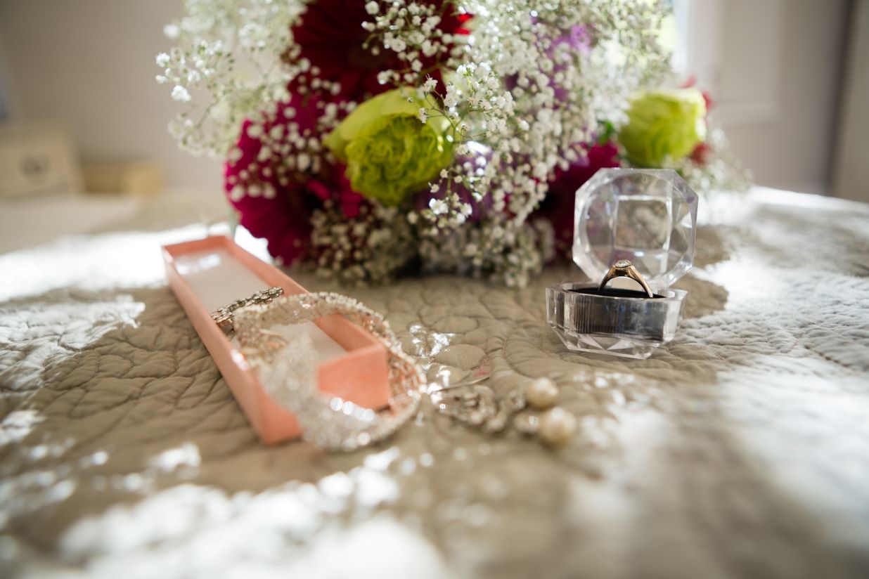 close-up-of-jewelry-and-bouquet-on-sofa