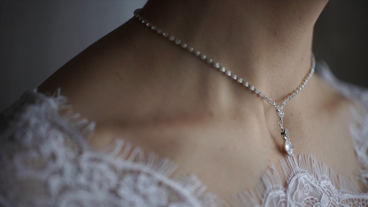 wedding-bracelet-and-necklace-woman-trying-on-jewellery